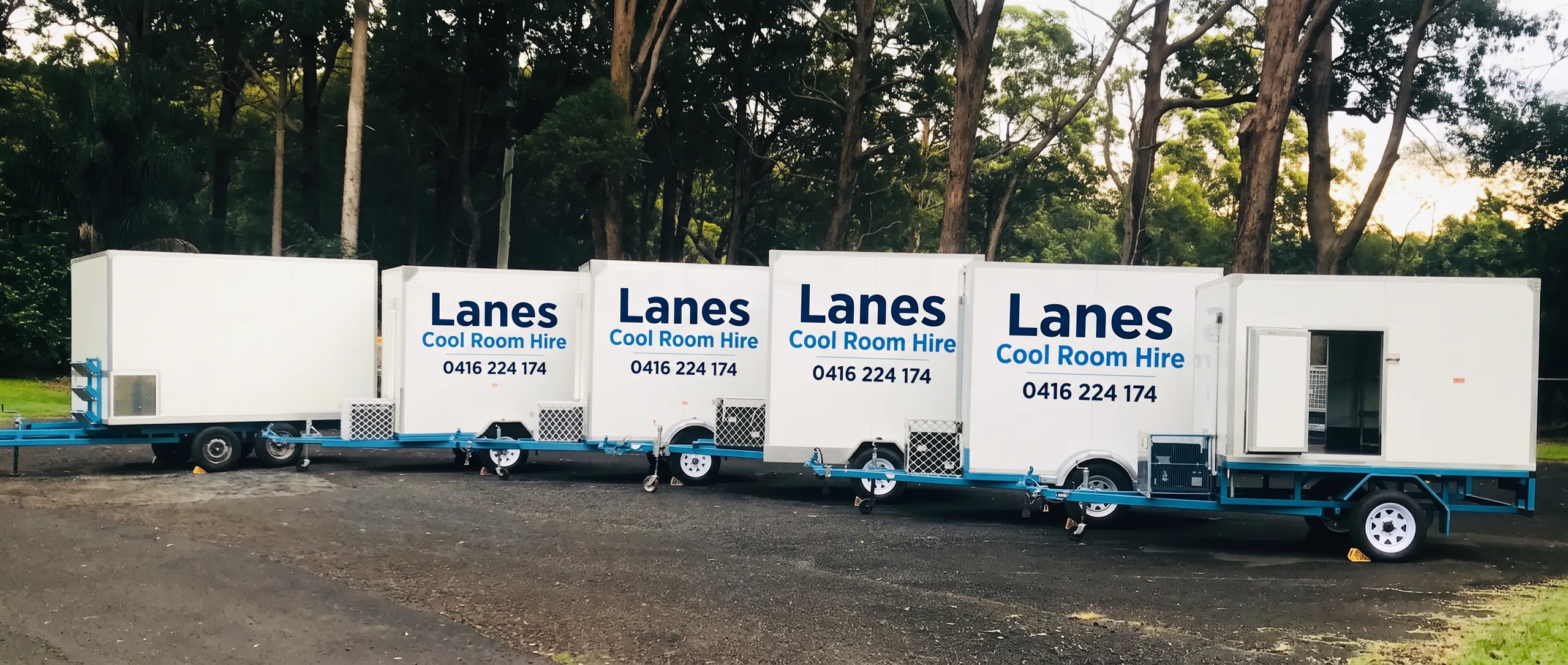 Row of Lanes Cool Room Hire trailers ready for hire
